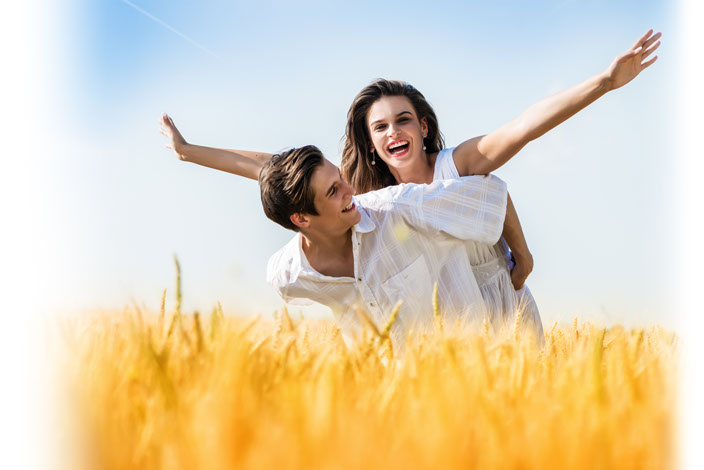 happy couple in a field